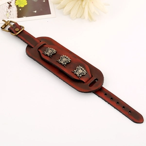 Vintage punk wide brown leather bracelet with bronze metal badges and buckle closure