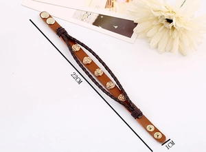 Detail view of multilayer leather bracelet with five golden roses and metal snap closure