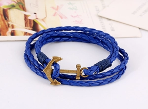 Detail of multi-layer blue leather braided bracelet with bronze alloy anchor clasp
