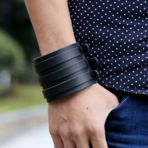 Men's retro punk multilayer wide leather bracelet worn naturally on a casual model's wrist