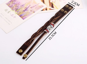 Detail view of multilayer braided leather bracelet with vintage metal beads and size 21.5cm
