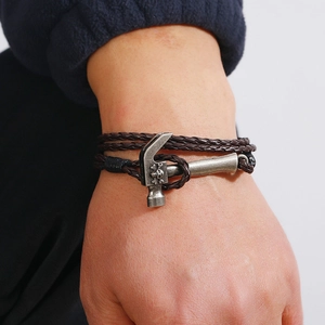 Retro multi-layer braided leather bracelet featuring a vintage silver hammer charm with skull