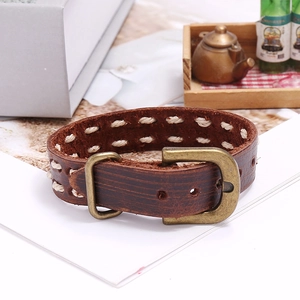 Retro dark brown leather bracelet with white woven stitching and bronze metal buckle