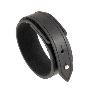 Minimalist black leather bracelet with double stitching and metal buckle on white background
