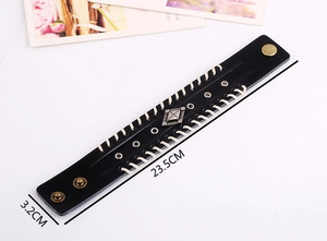 Détails du bracelet punk vintage en cuir noir avec bord tressé et bouton-pression laiton