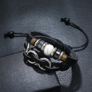 Handmade multi-layer leather bracelet with vintage beads on a black gift box