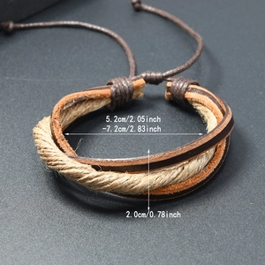 Handwoven vintage brown leather bracelet with adjustable cord on black background