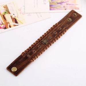 Vintage brown leather men's cuff bracelet with bronze cross relief and woven rope trim