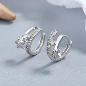 Detailed close-up of 925 silver star earrings with blue zircon and pavé setting