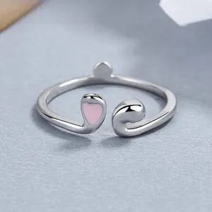 Macro detail of 925 sterling silver rabbit ring with pink heart enamel drip oil process