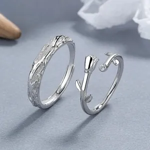 Macro detail of 925 silver couple rings featuring thorn textures and rose bud design