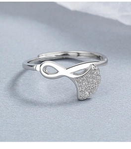 Macro shot of silver 925 ginkgo leaf ring with sparkling crystals and infinity design