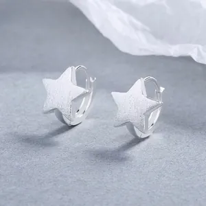 Detailed view of 925 silver star hoop earrings with a frosted matte finish texture