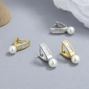 Detailed view of 925 silver pearl hoop earrings with zircon pavé in gold and silver finish
