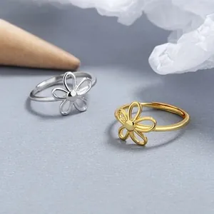 Macro shot of 925 silver hollow flower ring showing detailed petals and smooth texture