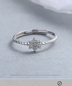 Macro shot of 925 sterling silver ring featuring a zircon flower and twisted rope band