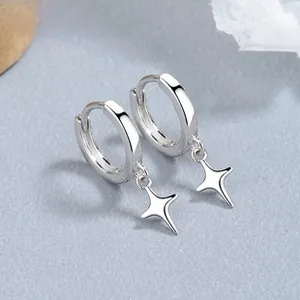 Macro shot of 925 sterling silver north star drop earrings with high polish finish