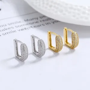 Close-up of S925 sterling silver U-shaped hoop earrings with pave cubic zirconia stones
