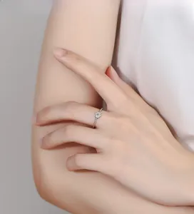 Detailed macro view of 925 silver flower ring with twisted band and zircon inlay