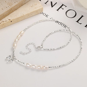 Elegant 925 sterling silver bow bracelet with white pearls and crushed silver beads