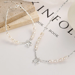 Elegant 925 sterling silver bow necklace and bracelet set with irregular pearls