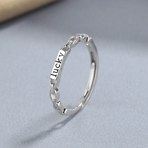 925 sterling silver chain ring featuring a lucky engraved plate with open design