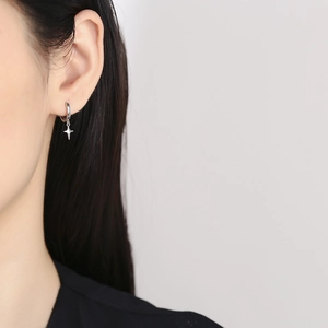 Minimalist 925 sterling silver hoop earrings with delicate north star charms for women