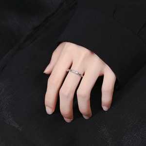 Minimalist 925 sterling silver chain ring with Lucky engraving shown on a hand