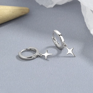 925 sterling silver hoop earrings with delicate four-pointed star charms in polished finish