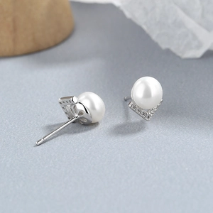 Elegant 925 sterling silver pearl stud earrings with sparkling V-shaped zircon inlay