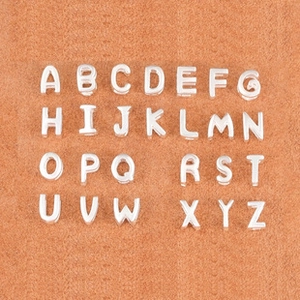 Detailed grid of silver 925 alphabet charms A-Z with a polished finish for DIY jewelry