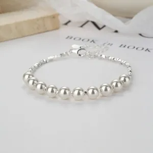 Detail of elegant 925 silver double-layer pearl bracelet with lobster clasp and chain