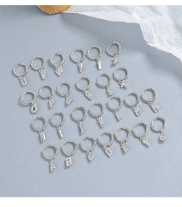 Macro shot of 925 sterling silver hoop earrings set with micro-paved zircon alphabets