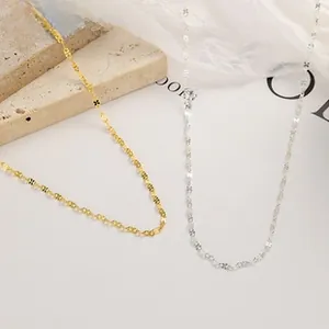 Detailed view of 925 sterling silver figure-8 link chain in gold and silver finishes