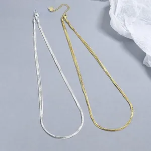 Detail of 925 sterling silver snake chains in gold and silver finishes with extensions