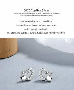 Detailed macro view of S925 sterling silver heart studs with white zircon inlay