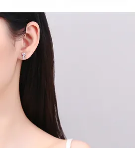 Detailed view of cat-shaped 925 silver stud earrings with sparkling cubic zirconia stones