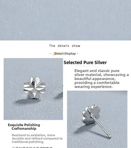 Macro details of S925 sterling silver four-leaf clover stud earrings with polished finish