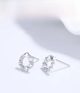 Macro shot of S925 sterling silver wreath earrings with sparkling round zirconia stones