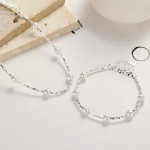 Elegant 925 sterling silver necklace and bracelet set with delicate white pearls