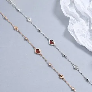 Close-up of 925 silver unicorn bracelets with cloud and coin pendants in rose gold and silver