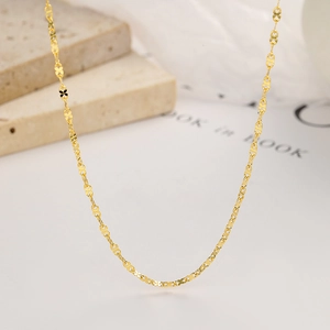 Elegant 925 sterling silver golden clover leaf chain necklace on a minimalist background