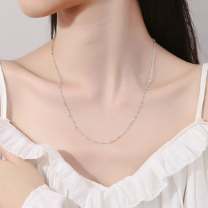 Sparkling 925 sterling silver figure-8 link necklace on a woman's neck for elegant look