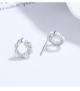 Macro view of 925 sterling silver wreath earrings with sparkling round cubic zirconia