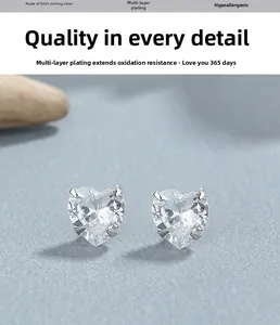 Macro shot of S925 sterling silver heart-shaped zircon earrings with four-prong setting