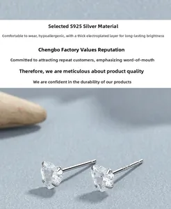Detailed view of S925 sterling silver stamp on heart-cut cubic zirconia stud earrings