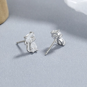 Cute 925 sterling silver cat stud earrings with zircon stones on dark texture