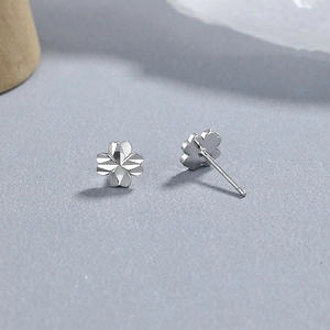 925 sterling silver four-leaf clover stud earrings with multi-faceted diamond-cut finish