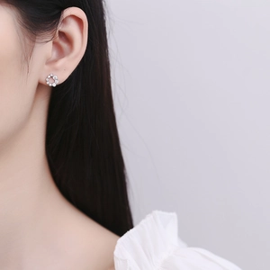Minimalist 925 sterling silver round hoop earrings with sparkling cubic zirconia on model