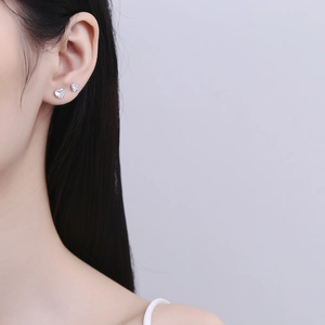 925 Sterling Silver Heart Stud Earrings with Clear Zirconia on Model